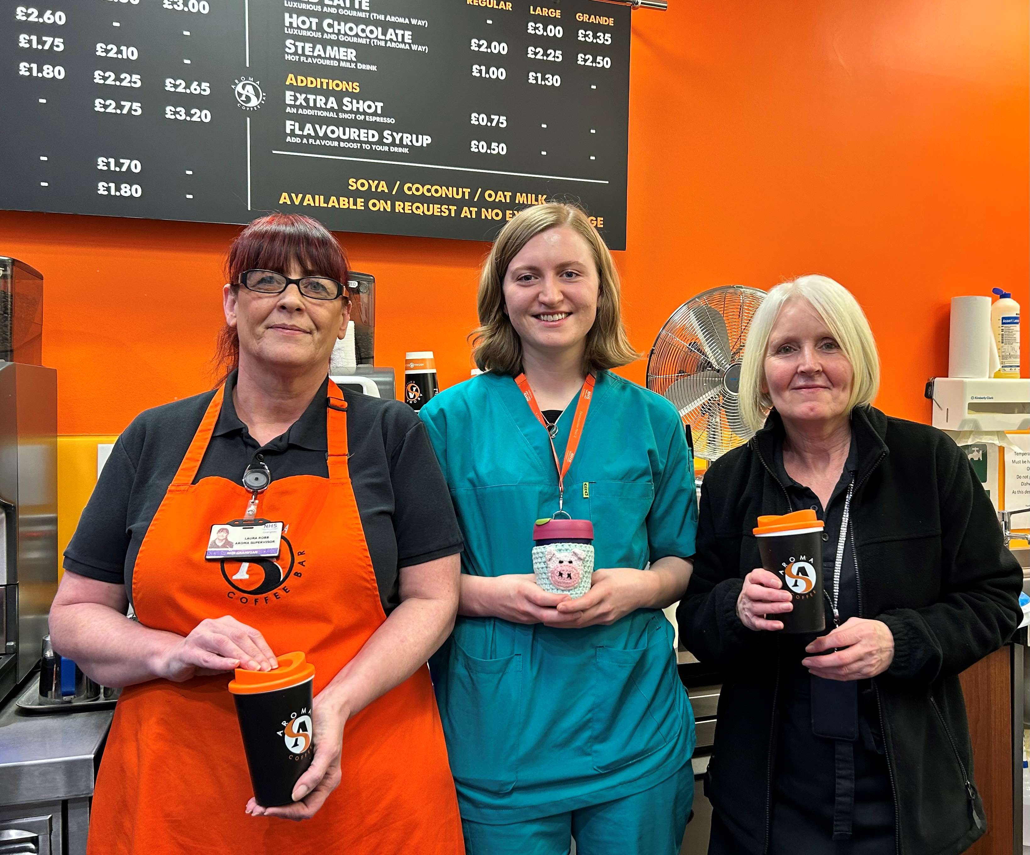 Photo of Sorcha and Aroma team members Laura (with the orange Apron) and Dorothy.