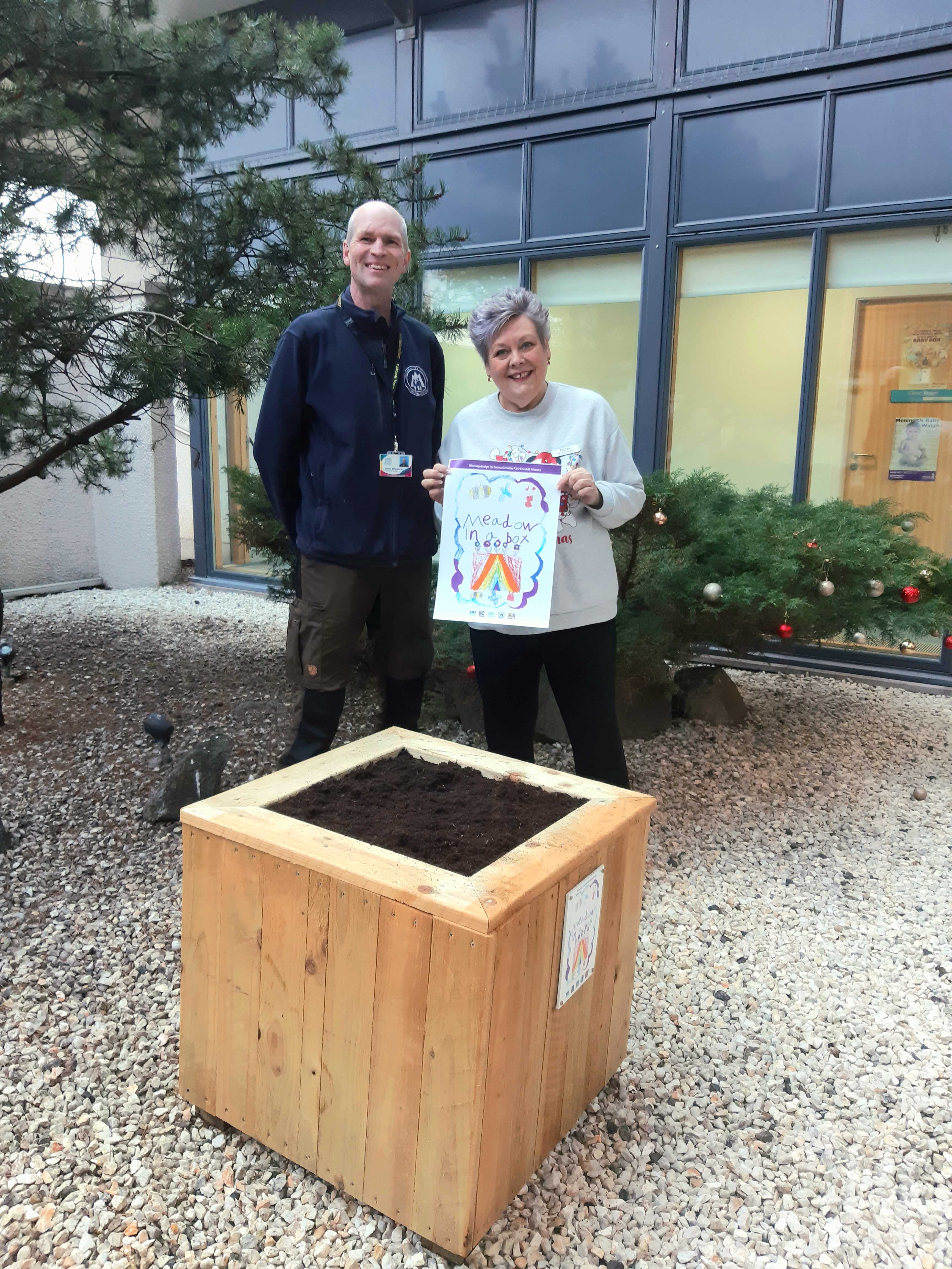 Photograph included shows City Council Countryside Officer, Simon Whitworth with receptionist Fiona Geddes from Cove Bay Medical Practice. The team there were pleased to receive their Meadow-in-a-Box last month.